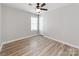 Bedroom features wood-look flooring and a modern ceiling fan at 15 Wright St, Rock Hill, SC 29730