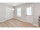 Bright dining area features natural light, white trim, and chandelier at 15 Wright St, Rock Hill, SC 29730