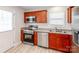 Updated kitchen featuring stainless steel appliances, cherry wood cabinets, and a bright and airy feel at 15 Wright St, Rock Hill, SC 29730