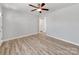 Spacious living room with neutral walls, updated flooring, ceiling fan, and an open doorway at 15 Wright St, Rock Hill, SC 29730