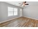 Inviting living room with neutral walls, wood-look floors, a ceiling fan, and ample natural light at 15 Wright St, Rock Hill, SC 29730