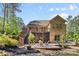 Beautiful backyard with a multi-level deck, fire pit, and access to a screened-in porch at 15210 Pavilion Valley Cir, Huntersville, NC 28078