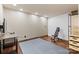 A finished basement exercise room features wood floors, recessed lighting, and a work out bench at 15210 Pavilion Valley Cir, Huntersville, NC 28078