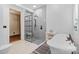 Elegant bathroom featuring a soaking tub, glass-enclosed shower, and stylish modern fixtures at 15210 Pavilion Valley Cir, Huntersville, NC 28078