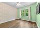 Bedroom features wood floor, light-green walls and large window at 15210 Pavilion Valley Cir, Huntersville, NC 28078