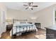 Bedroom offers wood floors, ceiling fan, and an abundance of natural light at 15210 Pavilion Valley Cir, Huntersville, NC 28078