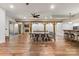 Spacious dining room features wood beams, fireplace, and seating for ten at 15210 Pavilion Valley Cir, Huntersville, NC 28078
