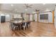 Spacious dining room features wood floors, beams, and modern fixtures at 15210 Pavilion Valley Cir, Huntersville, NC 28078