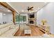 Inviting living room features stone fireplace, wood beams, and sliding glass doors to the outside at 15210 Pavilion Valley Cir, Huntersville, NC 28078