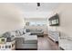 This living room features a comfortable sectional and abundant natural light at 15210 Pavilion Valley Cir, Huntersville, NC 28078