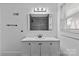 Bathroom featuring a modern vanity with under storage and large mirror at 1601 Gambia St, Charlotte, NC 28208