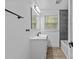Bathroom with modern vanity, fixtures, and tiled shower/tub at 1601 Gambia St, Charlotte, NC 28208