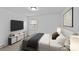 This bedroom features a TV and decorative console beneath the window for added ambiance at 1601 Gambia St, Charlotte, NC 28208