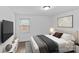 Cozy bedroom featuring neutral decor, window and stylish accents at 1601 Gambia St, Charlotte, NC 28208