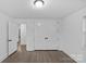 A bright bedroom features a large closet for storage space and hardwood flooring throughout the room at 1601 Gambia St, Charlotte, NC 28208