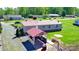 Aerial shot of the home features an outdoor kitchen/bar area and ample yard space at 161 Hickory Nut Dr, Statesville, NC 28677