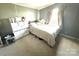Modest bedroom with natural light and a set of drawers for storage at 161 Hickory Nut Dr, Statesville, NC 28677