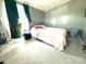 Cozy bedroom featuring a soft bed and bright natural light from a nearby window at 161 Hickory Nut Dr, Statesville, NC 28677