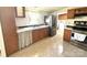 Bright kitchen with wooden cabinets, stainless steel appliances, and a window with natural light at 161 Hickory Nut Dr, Statesville, NC 28677