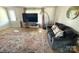 Comfortable living room features a couch, rug, and television at 161 Hickory Nut Dr, Statesville, NC 28677