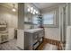 Bright bathroom features a modern vanity, wood-look tile floor, and shower with white subway tile at 1680 Ne 17Th Avenue Ct, Hickory, NC 28601
