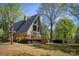 Spacious A-frame home boasts a large deck, garage, and storage building, with surrounding trees at 1680 Ne 17Th Avenue Ct, Hickory, NC 28601