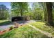 Exterior view of car port, shed and gravel driveway on a well manicured lawn at 1680 Ne 17Th Avenue Ct, Hickory, NC 28601