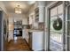 Kitchen with stainless appliances and white cabinets leading to outdoor porch at 1680 Ne 17Th Avenue Ct, Hickory, NC 28601