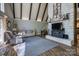 Open living room with stone fireplace, wood floors, and comfortable seating at 1680 Ne 17Th Avenue Ct, Hickory, NC 28601