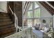 Bright living room features vaulted ceiling, large windows, and cozy seating area at 1680 Ne 17Th Avenue Ct, Hickory, NC 28601