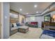 Basement with large sectional, brick accent wall, and day bed at 1680 Ne 17Th Avenue Ct, Hickory, NC 28601