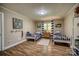 Bedroom featuring two twin beds, striped curtains, and wood-look flooring at 1680 Ne 17Th Avenue Ct, Hickory, NC 28601