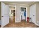 Bedroom with doorway to hallway, open closet, and wood-look floors at 1680 Ne 17Th Avenue Ct, Hickory, NC 28601