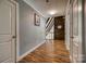 Hallway with wood floors and a view of the stairwell and the upstairs loft at 1680 Ne 17Th Avenue Ct, Hickory, NC 28601