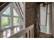 Bright living room featuring large windows, wood beams, and a ceiling fan at 1680 Ne 17Th Avenue Ct, Hickory, NC 28601
