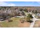 Aerial view showing house among other houses with trees at 189 Woodwinds Dr, Mooresville, NC 28115