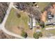Aerial view of a home, featuring a spacious yard and surrounding trees at 189 Woodwinds Dr, Mooresville, NC 28115