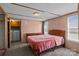 Bedroom with a wooden bed frame, neutral carpet, and a nearby laundry area with washer and dryer at 189 Woodwinds Dr, Mooresville, NC 28115