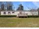 One-story home with a cozy front porch, red shutters, and a spacious front lawn at 189 Woodwinds Dr, Mooresville, NC 28115