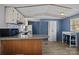 A kitchen features granite countertops, a tile backsplash, and an eat-in bar space at 189 Woodwinds Dr, Mooresville, NC 28115