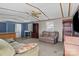 Open living space, features sofas, shelving and and adjoined eat-in kitchen at 189 Woodwinds Dr, Mooresville, NC 28115