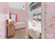Bright bedroom featuring a closet desk, soft carpet, and lovely bird pattern wallpaper at 1921 Brandon Cir, Charlotte, NC 28211