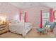 Inviting bedroom with patterned wallpaper, hardwood floors, and natural light from the windows at 1921 Brandon Cir, Charlotte, NC 28211