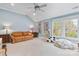 Spacious bonus room with natural light, plush seating, and a cozy atmosphere at 1921 Brandon Cir, Charlotte, NC 28211