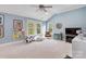 Large bonus room with vaulted ceiling, three windows, cozy seating, and ample space for activities at 1921 Brandon Cir, Charlotte, NC 28211