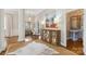 Elegant foyer with a mirrored console table, hardwood flooring, and views into adjacent living spaces at 1921 Brandon Cir, Charlotte, NC 28211