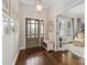 Elegant foyer featuring hardwood floors, sophisticated decor, and access to other living spaces at 1921 Brandon Cir, Charlotte, NC 28211