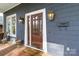 Elegant front door with sidelights, decorative lighting, and a welcoming entrance to the home at 1921 Brandon Cir, Charlotte, NC 28211
