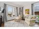 Comfortable living room area with plush seating, a neutral color scheme, and natural light from the windows at 1921 Brandon Cir, Charlotte, NC 28211