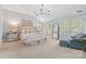 Airy main bedroom with sitting area, vaulted ceiling, and French doors to the backyard at 1921 Brandon Cir, Charlotte, NC 28211